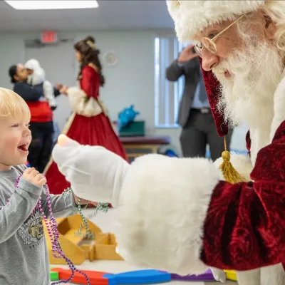 Santa visits AdventHealth Ocala Pediatric Rehab Patient.