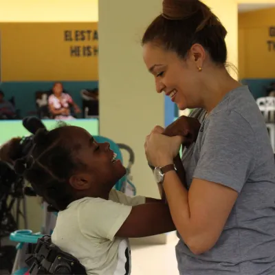 A medical worker assists a child