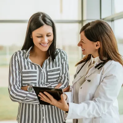 Physician showing information to patient