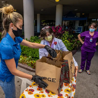 Woman holding food donations