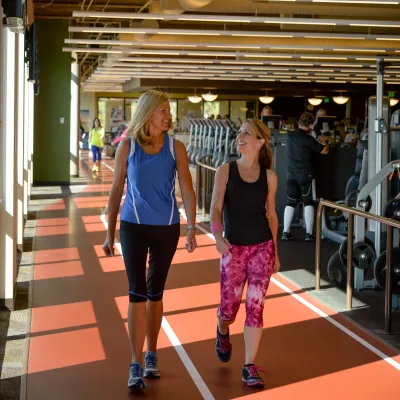 Two Ladies Enjoy Walking Together.