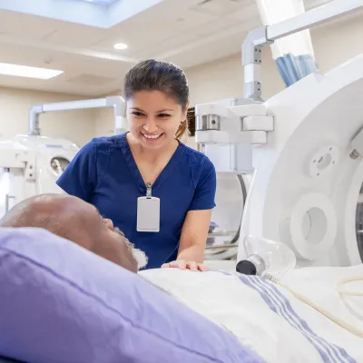 A nurse comforting a patient with her presence