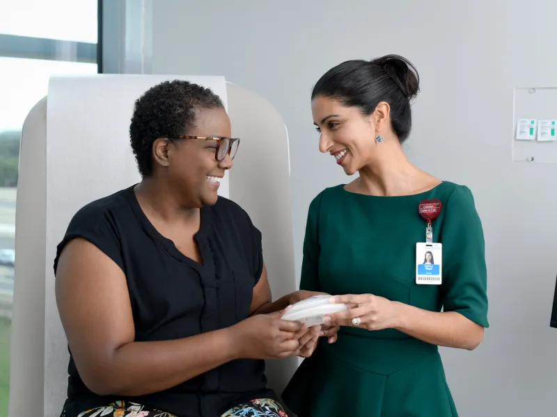 A Plastic Surgeon Consults a Patient on Breast Augmentation
