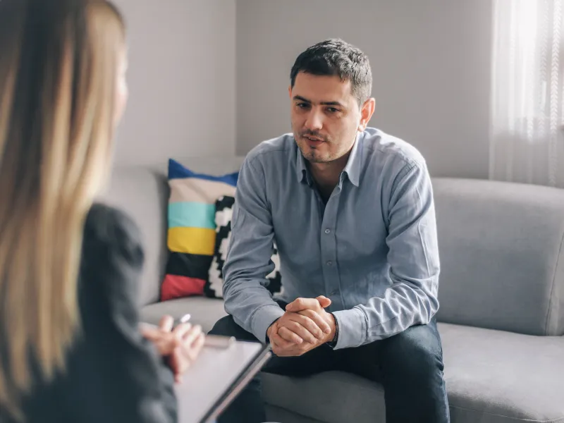 A man taking to a therapist.