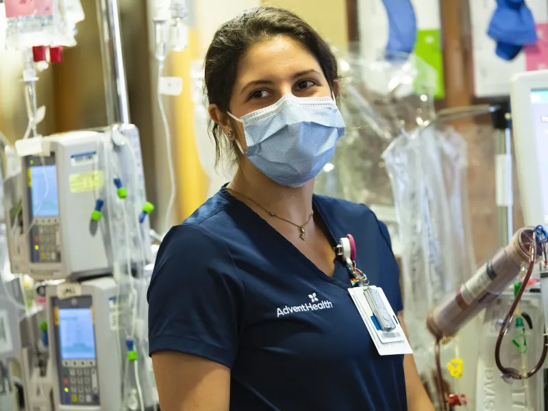 A nurse wearing a face mask at a facility. 