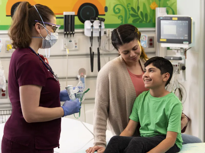 A young boy in a pediatric visit with his mother.