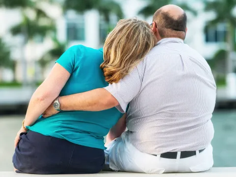 A mature couple showing their love outdoors