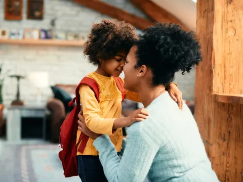 A Mother is Nose to Nose with Her Daughter Just as She's About to Leave For School