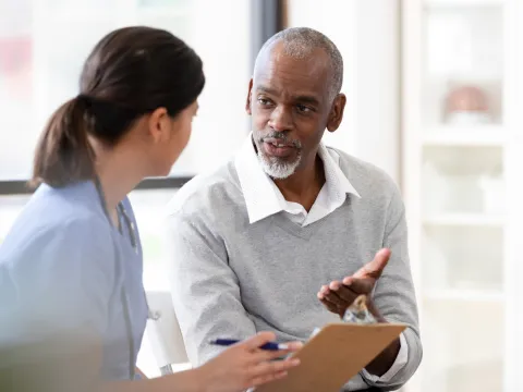 A Patient Speaks with a Provider in an Exam Room of a Medical Practice.