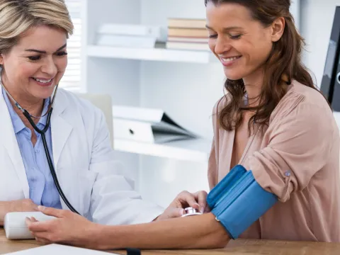 Woman checking her blood pressure