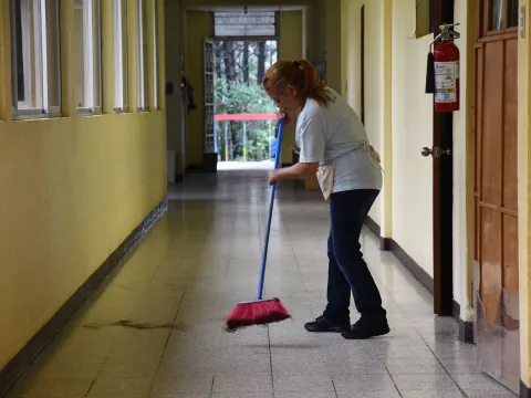 An AdventHealth team member sweeps the floor at the malnutrition center in Guatemala.