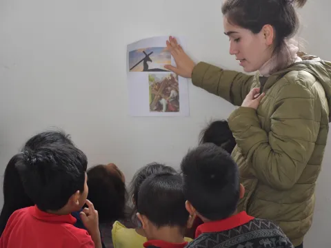 A teacher at the malnutrition center tells Bible stories to her kids.