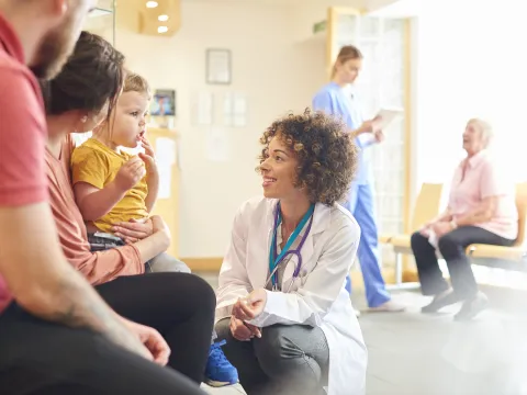 Doctor with Child and Family