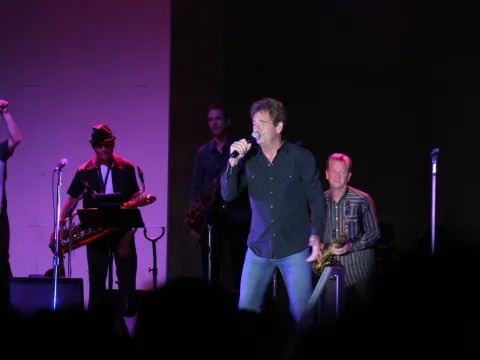 Huey Lewis & The News performing.