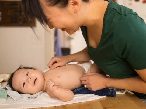 Mom Laughing with Infant