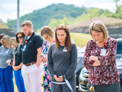 Team members at AdventHealth Manchester gather for National Day of Prayer.