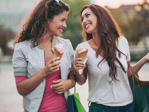 Two women enjoying ice cream.