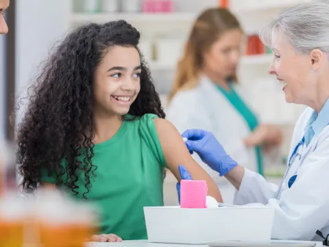 Young girl getting a flu shot