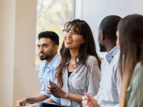 A Group of Young Professionals Having a Group Discussion in a Class.