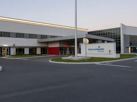 Exterior of AdventHealth Wauchula at dusk.