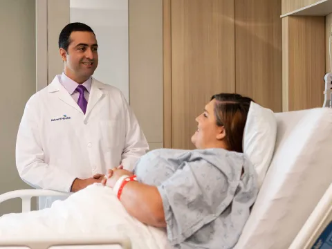 A bariatric doctor talking to his female patient.