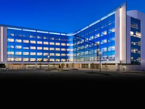 The V-shaped Texas Huguley building at night