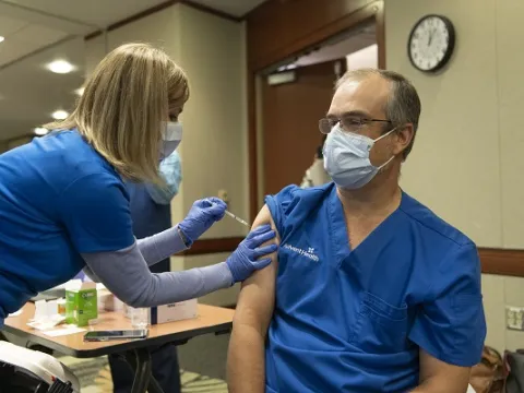 Dr. Oliveira receives a COVID-19 Vaccination at AdventHealth Orlando