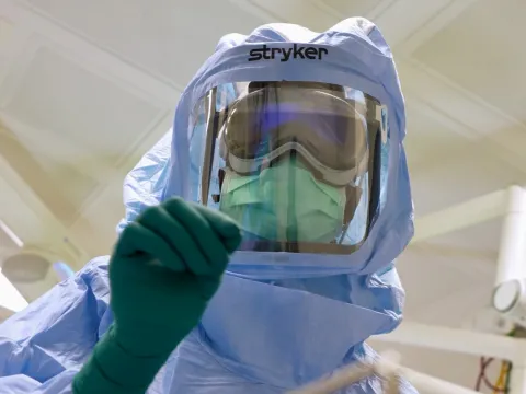 AdventHealth surgical tech, Natasha Francois, dons sterile suit and uses innovative Apple Vision Pro based surgical assist system