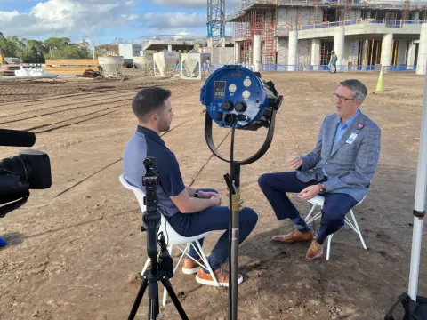 Brian Adams sits down for an interview with a reporter from News 6. 