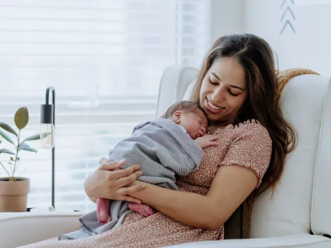 mother kisses a baby's hands peek-a-boo adventhealth gordon