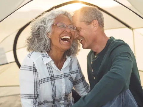 A couple laughing.