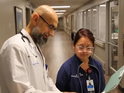 Physicians chatting in hallway