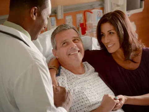 Physician with and Patient and family
