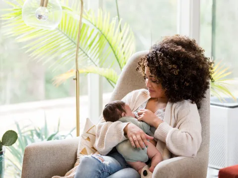 Woman nursing her baby.