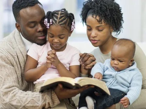 Family praying together