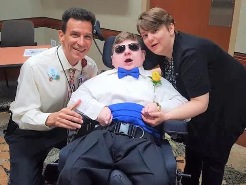 Jeff Cousins with his son and his wife.