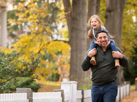Father and Daughter walking outdoors