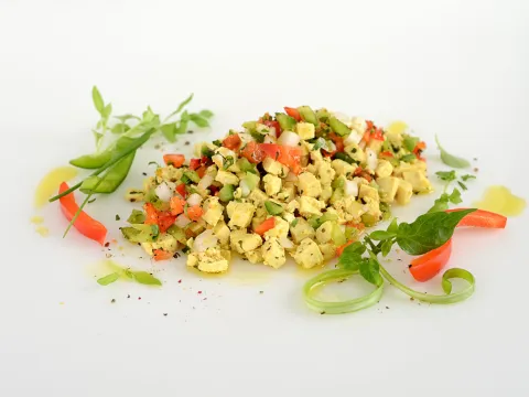 scrambled tofu mixed with bell peppers and onions