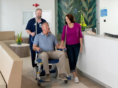 A Patient is Wheeled Through the Lobby of AdventHealth ER at Flamingo Crossing Town Center