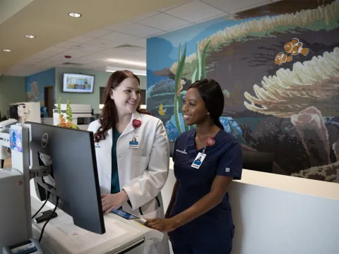 AdventHealth Employees at the FLAMINGO CROSSINGS Town Center front desk