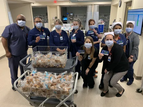 A group of nurses wearing masks with donations.