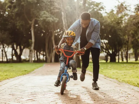 Man and son ride bike