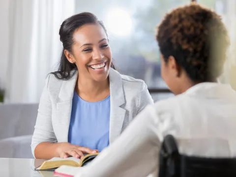 A CPE Pastor Reads the Bible to a Patient