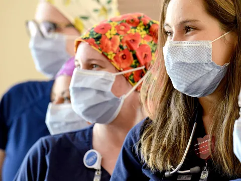 A group of nurses wearing face masks.