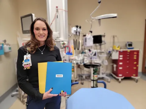 Nurse Heather Foucault stands in a patient room at AdventHealth Parker