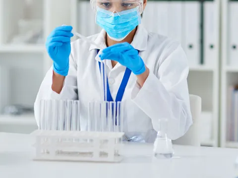 A lab technician working in the lab. 