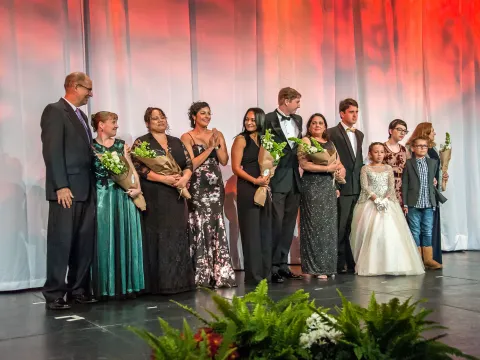 Families on stage at AdventHealth Golden Gala XXXVIII