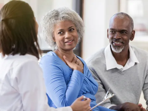 A couple discusses heart health with their doctor.