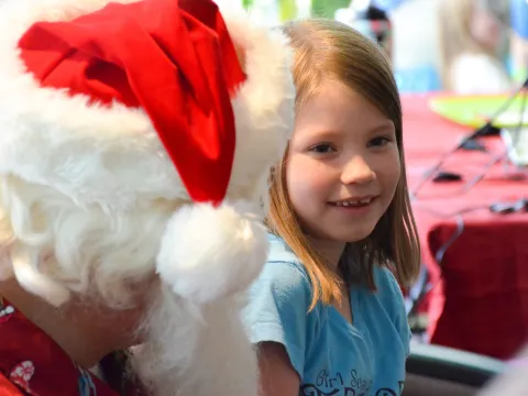 A child at AdventHealth celebrates Christmas in July.