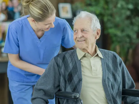 An older man in a wheelchair.